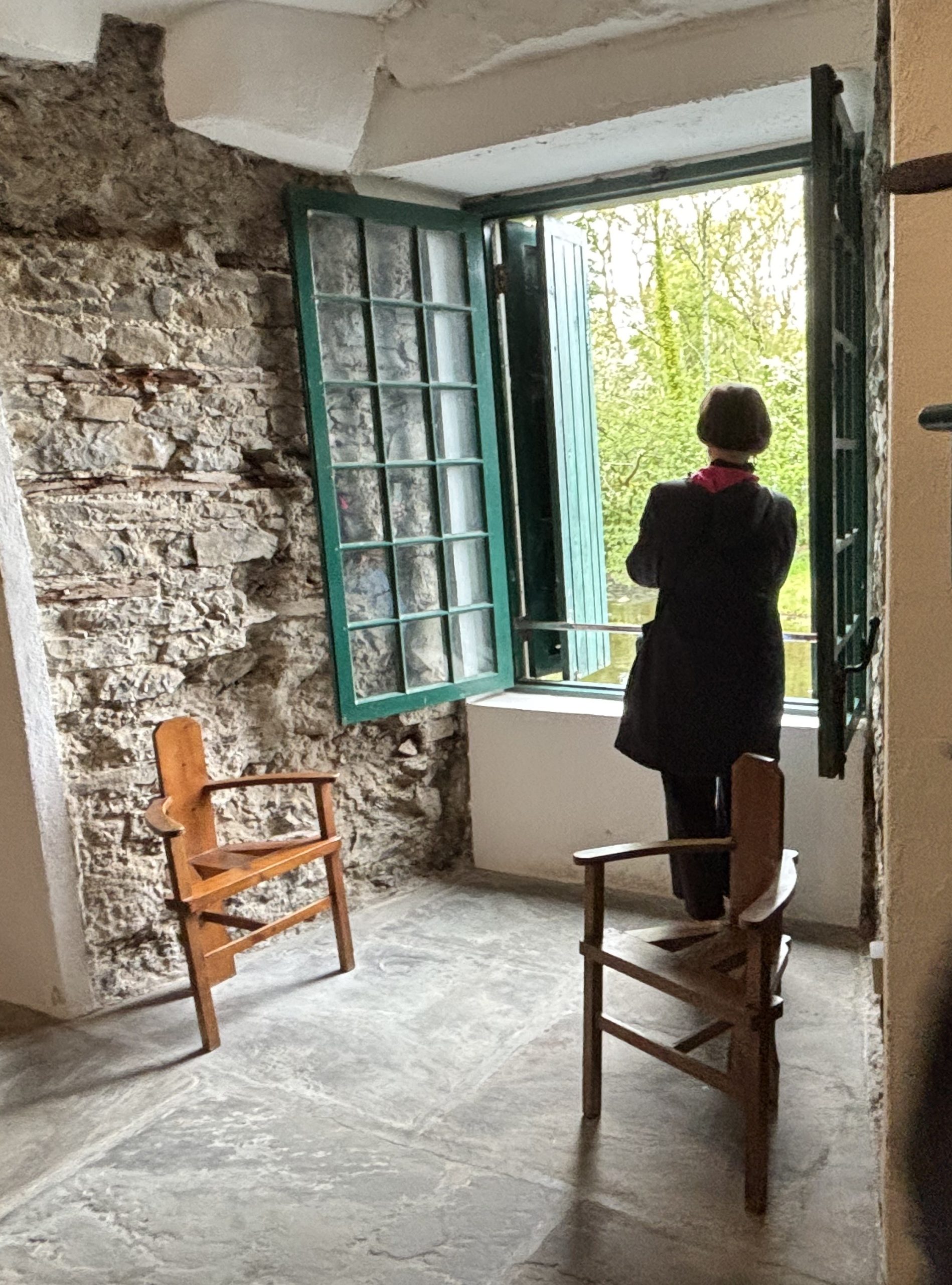 Poet Maura MacNeil looks out the window of one of Yeats' sitting rooms. Credit: Meg. Kearney